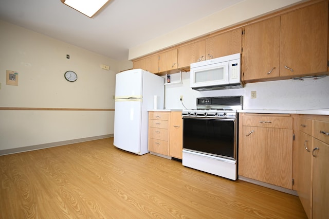 952 Fuller St S, Shakopee, MN 55379 - kitchen with white appliances, light wood-style flooring, and light countertops