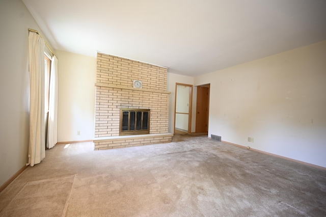 952 Fuller St S, Shakopee, MN 55379 - unfurnished living room with carpet floors, a brick fireplace, and baseboards