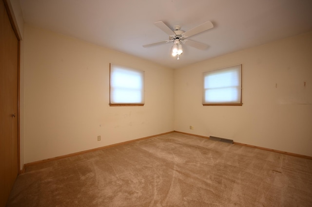 952 Fuller St S, Shakopee, MN 55379 - empty room with healthy amount of natural light, light carpet, baseboards, and ceiling fan