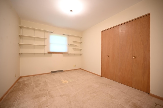 952 Fuller St S, Shakopee, MN 55379 - unfurnished bedroom featuring light carpet, a closet, and baseboards