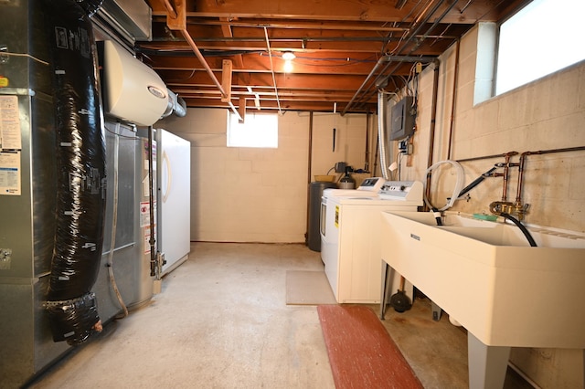 952 Fuller St S, Shakopee, MN 55379 - basement featuring washing machine and clothes dryer, a sink, and heating unit