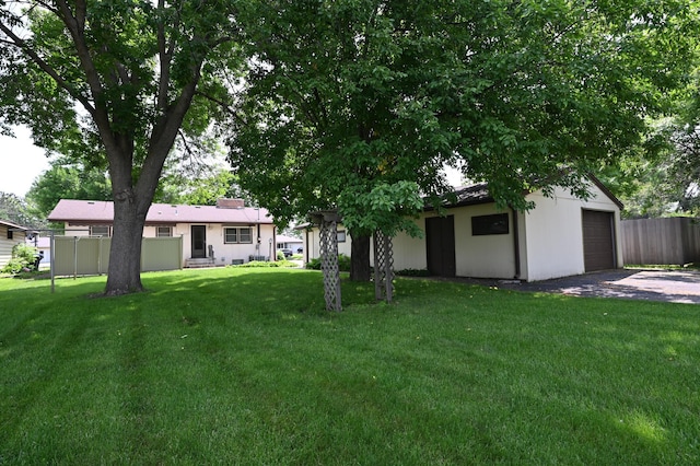 952 Fuller St S, Shakopee, MN 55379 - view of yard featuring driveway and a garage