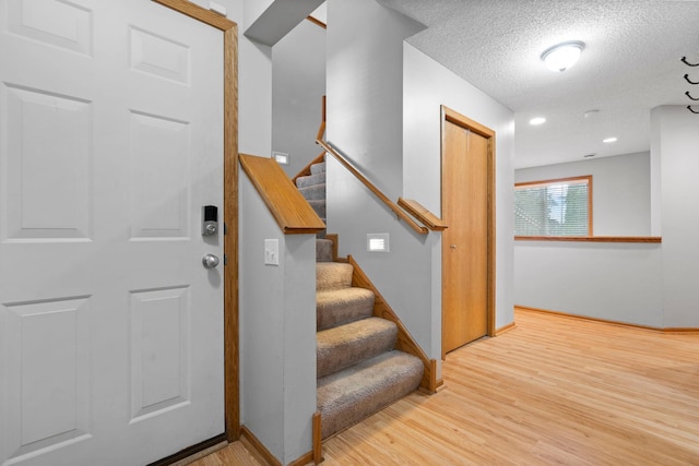 3168 Molina St, Shakopee, MN 55379 - stairway with wood finished floors and a textured ceiling