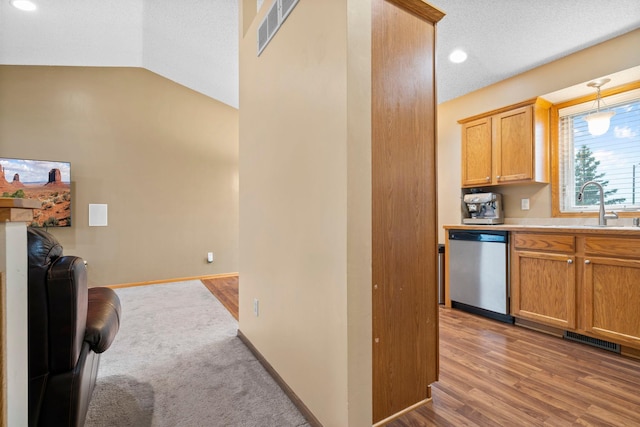 3168 Molina St, Shakopee, MN 55379 - kitchen with dishwasher, light countertops, lofted ceiling, recessed lighting, and open floor plan