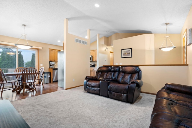 3168 Molina St, Shakopee, MN 55379 - living area with vaulted ceiling, carpet flooring, and recessed lighting
