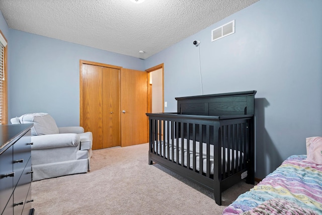3168 Molina St, Shakopee, MN 55379 - bedroom featuring carpet flooring, a textured ceiling, and a closet