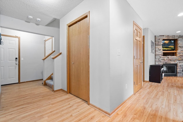 3168 Molina St, Shakopee, MN 55379 - corridor featuring wood finished floors, stairs, and a textured ceiling