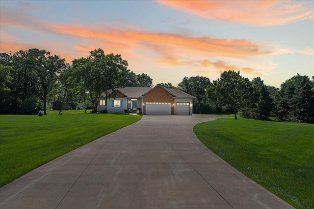 1195 64th St, Hudson, WI 54016 - ranch-style house featuring an attached garage, driveway, and a yard