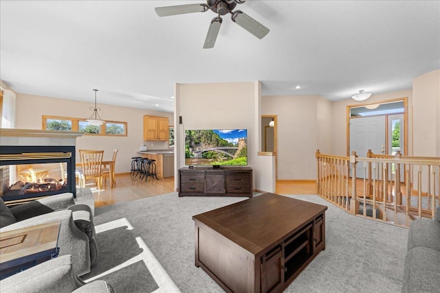 1195 64th St, Hudson, WI 54016 - living area featuring ceiling fan, light carpet, a multi sided fireplace, and recessed lighting