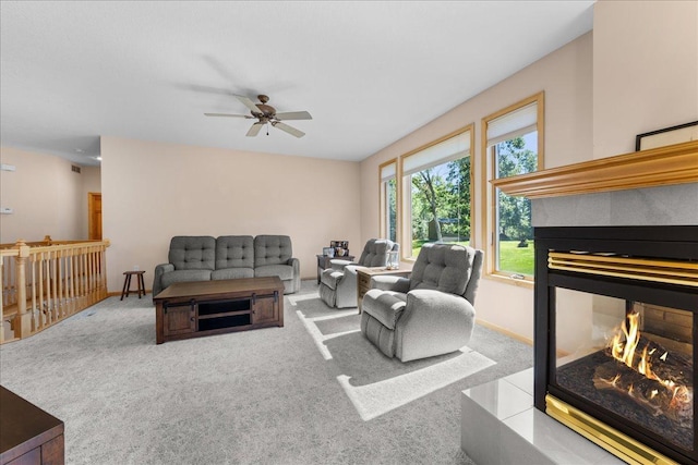 1195 64th St, Hudson, WI 54016 - carpeted living area with a multi sided fireplace and ceiling fan