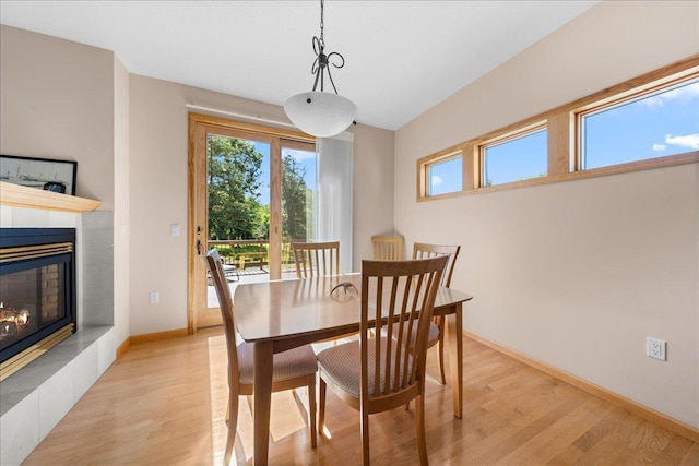 1195 64th St, Hudson, WI 54016 - dining space featuring light wood-style floors and a fireplace