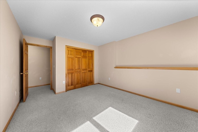 1195 64th St, Hudson, WI 54016 - unfurnished bedroom with a closet and carpet flooring