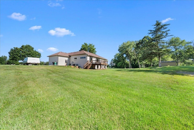 1195 64th St, Hudson, WI 54016 - view of green lawn featuring stairs and a wooden deck