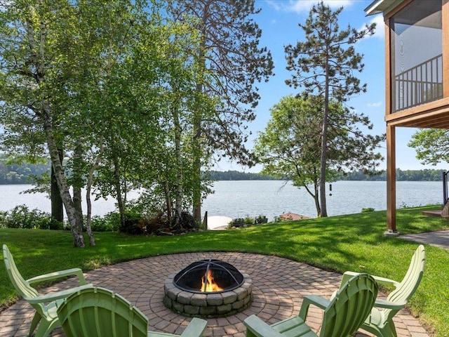 12144 Sylvan Dr SW, Sylvan Twp, MN 56473 - view of patio / terrace featuring a fire pit and a water view