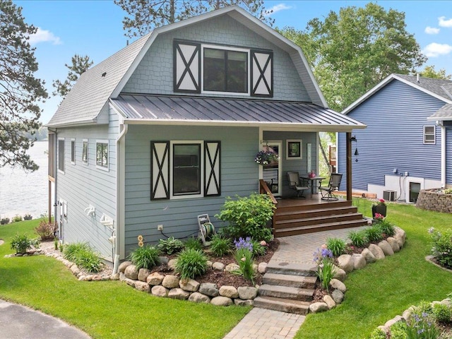 12144 Sylvan Dr SW, Sylvan Twp, MN 56473 - colonial inspired home featuring a front lawn, covered porch, a standing seam roof, and a metal roof