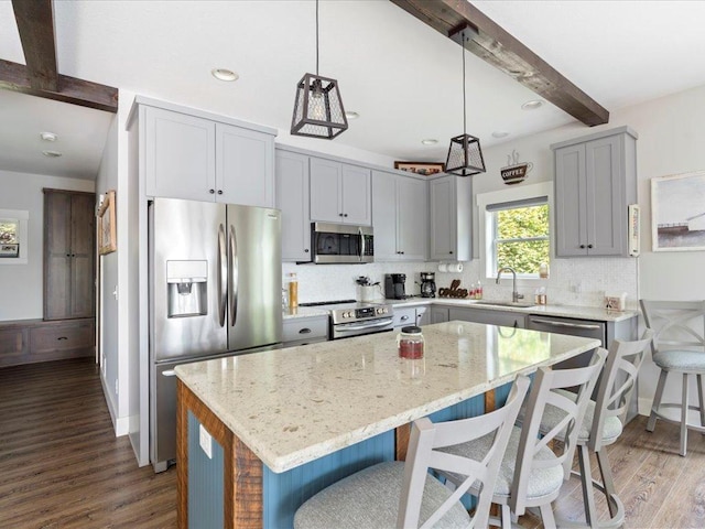 12144 Sylvan Dr SW, Sylvan Twp, MN 56473 - kitchen with stainless steel appliances, beamed ceiling, dark wood-style floors, light stone countertops, and backsplash