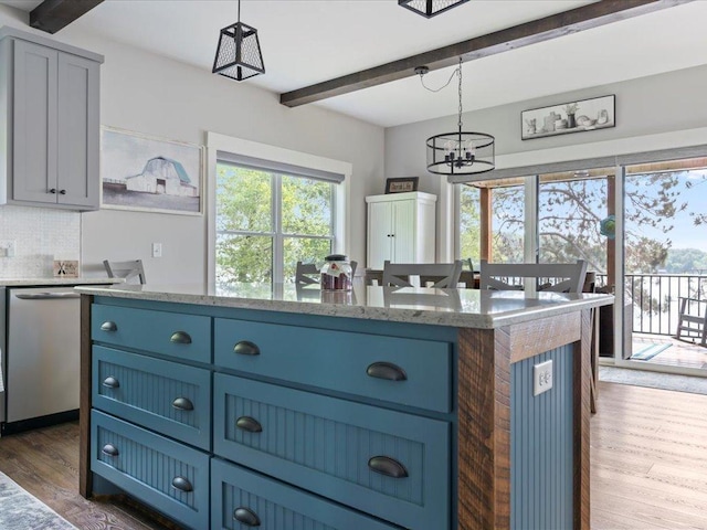 12144 Sylvan Dr SW, Sylvan Twp, MN 56473 - kitchen with beamed ceiling, blue cabinetry, dark wood-style flooring, a chandelier, and hanging light fixtures