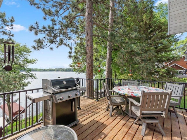 12144 Sylvan Dr SW, Sylvan Twp, MN 56473 - wooden deck with grilling area, outdoor dining space, and a water view