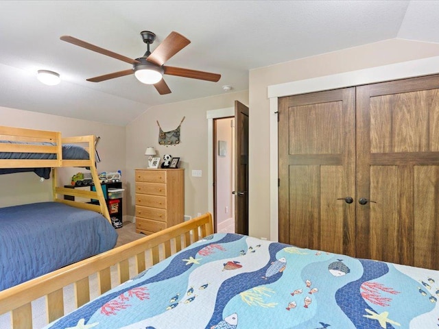 12144 Sylvan Dr SW, Sylvan Twp, MN 56473 - carpeted bedroom with vaulted ceiling, a ceiling fan, and a closet