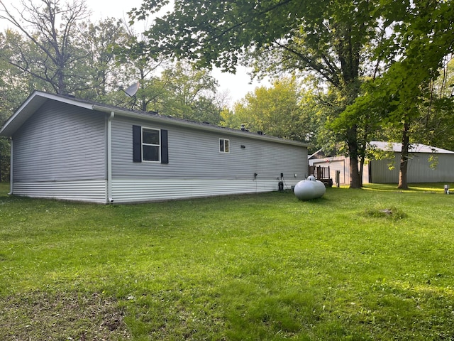 23324 State Highway 107, Grasston, MN 55030 - view of side of home with a yard