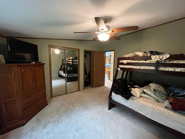 23324 State Highway 107, Grasston, MN 55030 - bedroom featuring light colored carpet, two closets, ceiling fan, and a textured ceiling