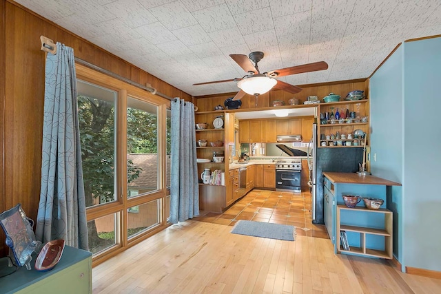 895 Front, Saint Paul, MN 55103 - kitchen featuring open shelves, appliances with stainless steel finishes, wooden walls, light countertops, and a ceiling fan