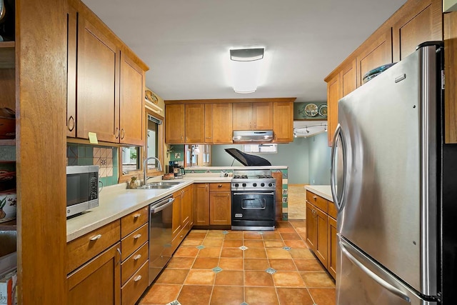 895 Front, Saint Paul, MN 55103 - kitchen featuring stainless steel appliances, light countertops, light tile patterned floors, and brown cabinets