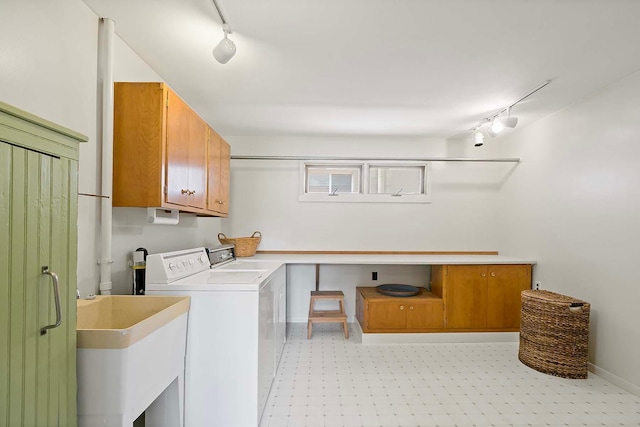 895 Front, Saint Paul, MN 55103 - laundry area featuring cabinet space, rail lighting, light floors, and washing machine and dryer