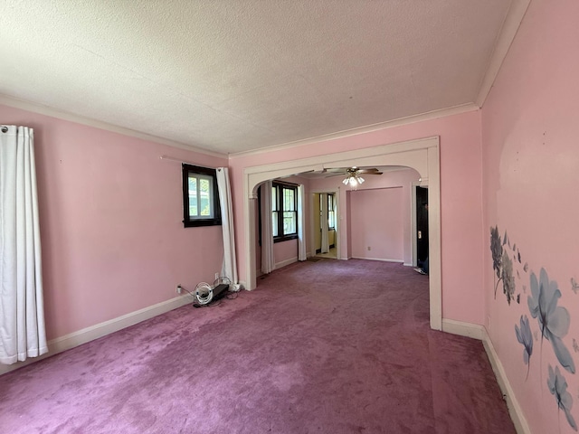 845 Sims Ave, Saint Paul, MN 55106 - empty room featuring arched walkways, carpet, a textured ceiling, ornamental molding, and baseboards