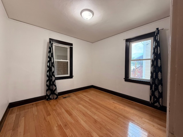 845 Sims Ave, Saint Paul, MN 55106 - empty room featuring light wood finished floors and baseboards
