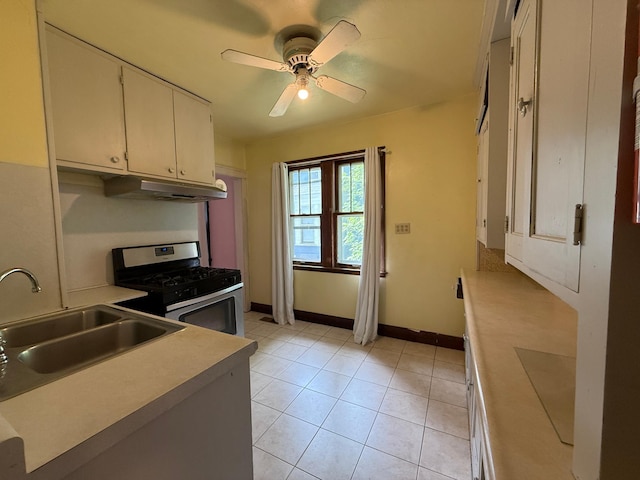 845 Sims Ave, Saint Paul, MN 55106 - kitchen with stainless steel gas stove, a sink, under cabinet range hood, light countertops, and a ceiling fan