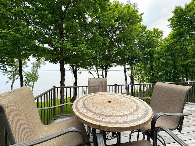 2438 Birch Point Rd, Greenwood Twp, MN 55790 - deck with outdoor dining space and a water view