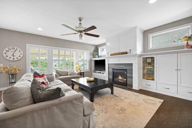 3710 Talero Curv, Chaska, MN 55318 - living room featuring dark wood-style floors, recessed lighting, ceiling fan, a tile fireplace, and healthy amount of natural light