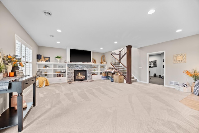 3710 Talero Curv, Chaska, MN 55318 - carpeted living area featuring stairway, recessed lighting, a stone fireplace, and baseboards