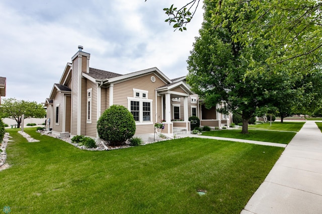 1365 Highpointe Dr N, Fargo, ND 58102 - view of front of property featuring a chimney and a front lawn