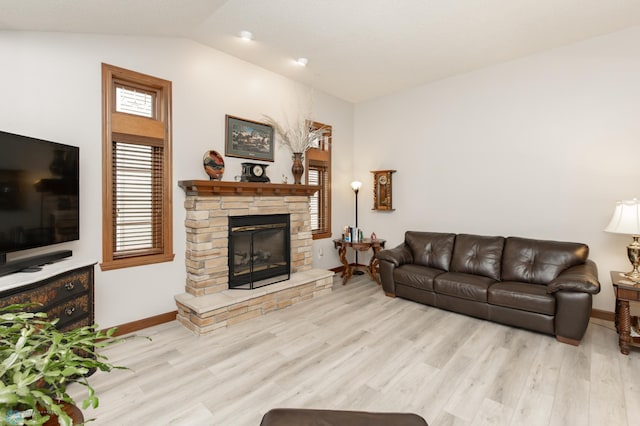 1365 Highpointe Dr N, Fargo, ND 58102 - living room with a stone fireplace, lofted ceiling, and wood finished floors