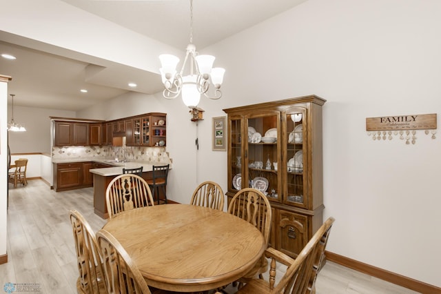 1365 Highpointe Dr N, Fargo, ND 58102 - dining room with a chandelier, light wood-style flooring, and recessed lighting