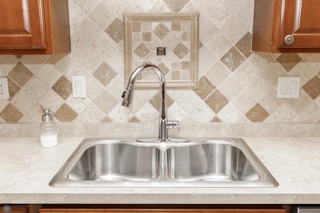 1365 Highpointe Dr N, Fargo, ND 58102 - kitchen view of light countertops, brown cabinetry, and decorative backsplash