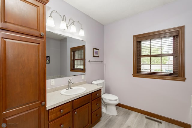 1365 Highpointe Dr N, Fargo, ND 58102 - bathroom with vanity and wood finished floors