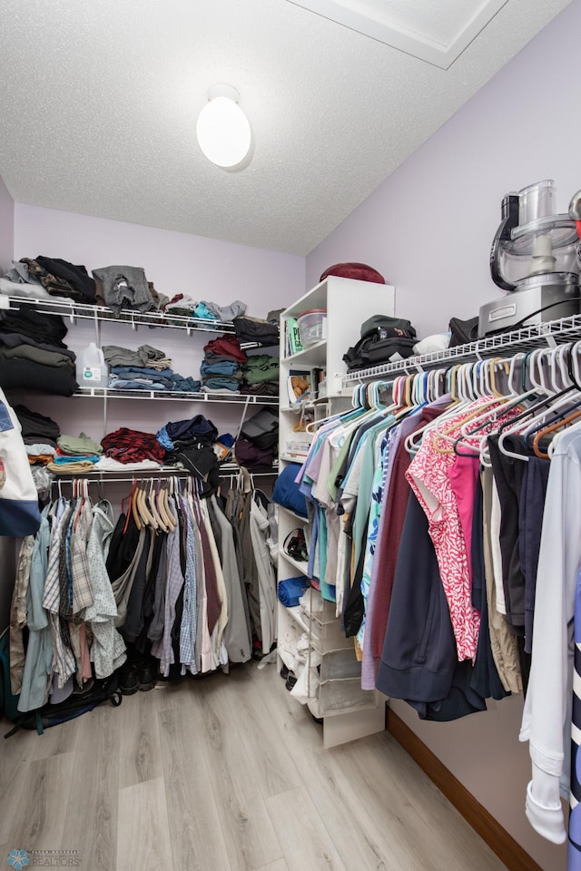 1365 Highpointe Dr N, Fargo, ND 58102 - spacious closet featuring wood finished floors