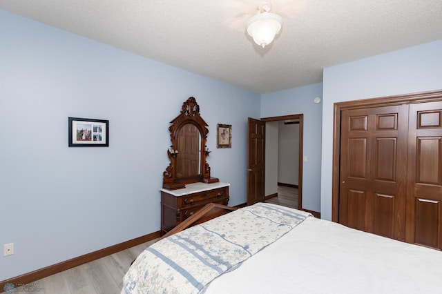 1365 Highpointe Dr N, Fargo, ND 58102 - bedroom with wood finished floors and a closet