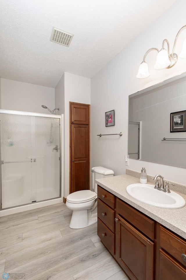 1365 Highpointe Dr N, Fargo, ND 58102 - full bathroom featuring a stall shower, vanity, and wood finished floors