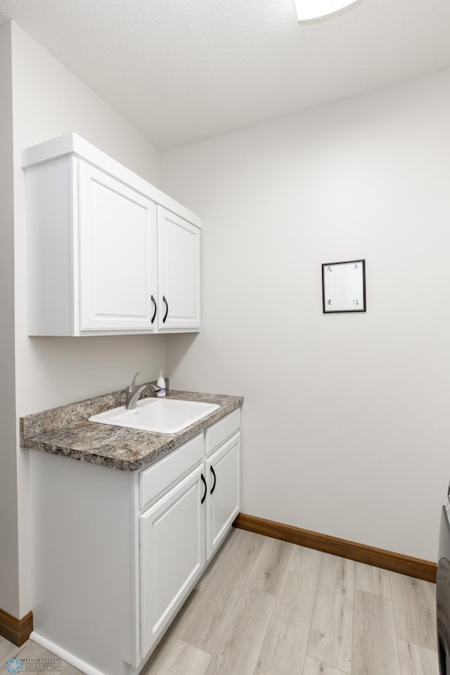 1365 Highpointe Dr N, Fargo, ND 58102 - washroom with a sink and light wood-style flooring