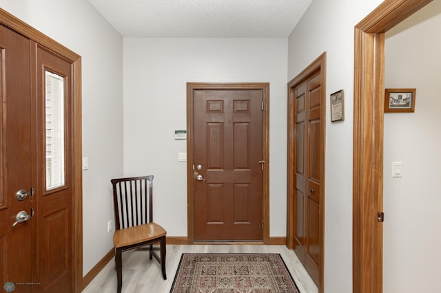 1365 Highpointe Dr N, Fargo, ND 58102 - foyer entrance with light wood-style flooring and baseboards