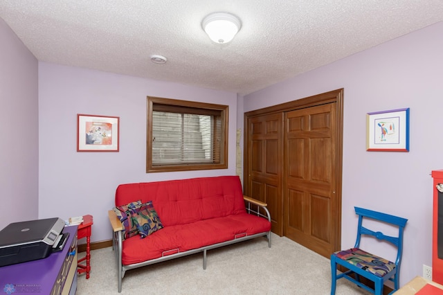 1365 Highpointe Dr N, Fargo, ND 58102 - sitting room featuring a textured ceiling and carpet flooring