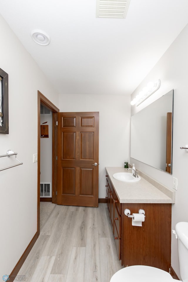 1365 Highpointe Dr N, Fargo, ND 58102 - bathroom featuring vanity and wood finished floors
