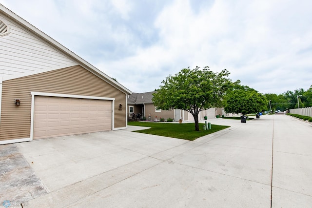 1365 Highpointe Dr N, Fargo, ND 58102 - view of front of home featuring a garage and a front yard