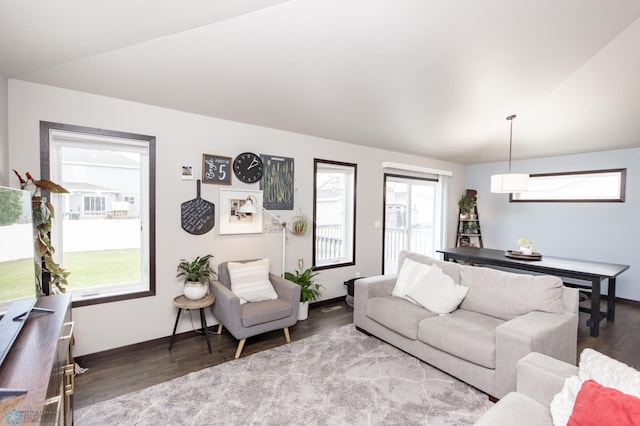 6675 57th Ave S, Fargo, ND 58104 - living room featuring wood finished floors and vaulted ceiling