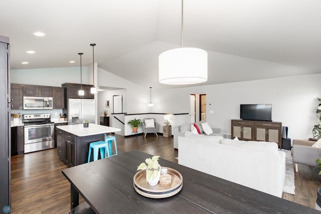 6675 57th Ave S, Fargo, ND 58104 - dining space featuring lofted ceiling, dark wood finished floors, and recessed lighting