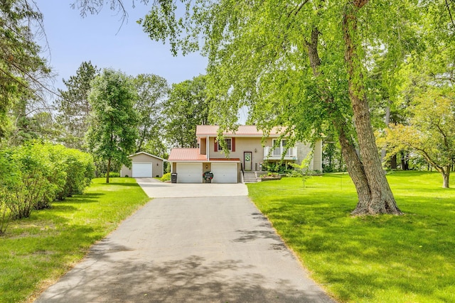 10275 Park Cir, Pine City, MN 55063 - split foyer home with a front yard, metal roof, a garage, and asphalt driveway